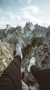 Preview wallpaper legs, sneakers, mountains