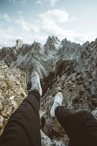 Preview wallpaper legs, sneakers, mountains