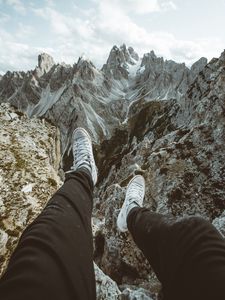 Preview wallpaper legs, sneakers, mountains