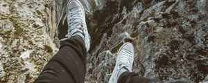 Preview wallpaper legs, sneakers, mountains