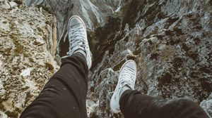Preview wallpaper legs, sneakers, mountains