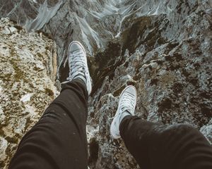 Preview wallpaper legs, sneakers, mountains