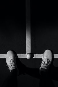 Preview wallpaper legs, sneakers, tennis ball, bw