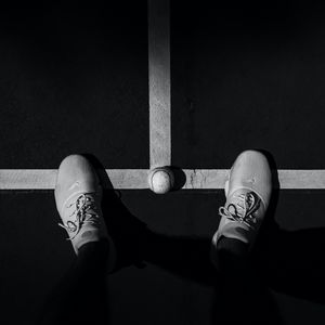 Preview wallpaper legs, sneakers, tennis ball, bw