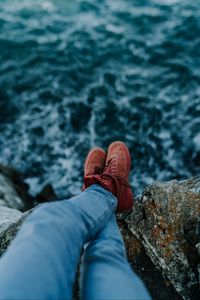 Preview wallpaper legs, stones, water, cliff