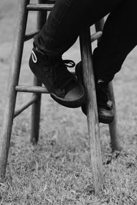 Preview wallpaper legs, stool, bw, sneakers, black
