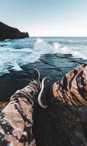 Preview wallpaper legs, waves, sneakers, rocks