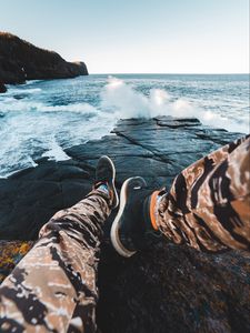 Preview wallpaper legs, waves, sneakers, rocks