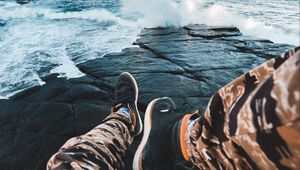 Preview wallpaper legs, waves, sneakers, rocks
