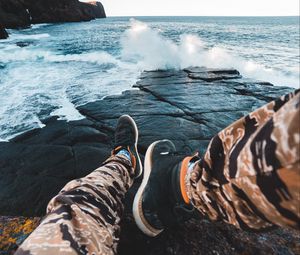 Preview wallpaper legs, waves, sneakers, rocks