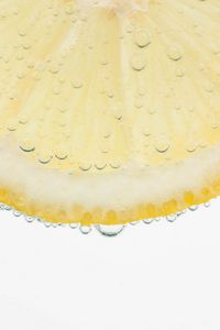 Preview wallpaper lemon, slice, bubbles, drops, yellow, white background, macro