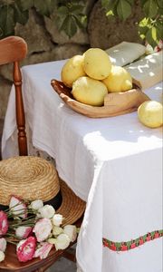 Preview wallpaper lemons, citruses, flowers, hat, chair, table