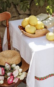 Preview wallpaper lemons, citruses, flowers, hat, chair, table