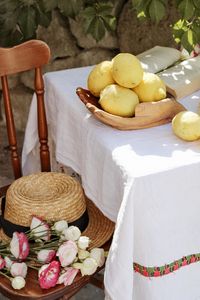 Preview wallpaper lemons, citruses, flowers, hat, chair, table