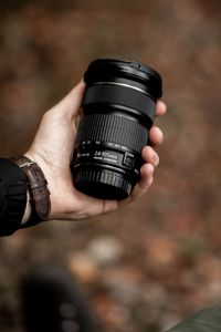 Preview wallpaper lens, black, hand, optics, camera