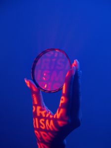 Preview wallpaper lens, hand, letters, fingers, dark