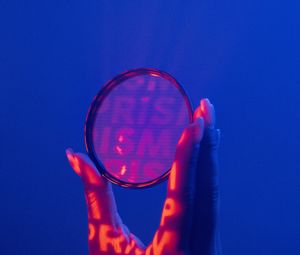 Preview wallpaper lens, hand, letters, fingers, dark