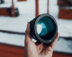 Preview wallpaper lens, hand, optics, camera