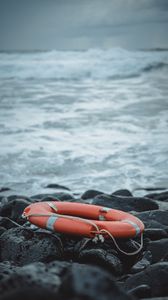 Preview wallpaper lifebuoy, sea, shore, stones, waves