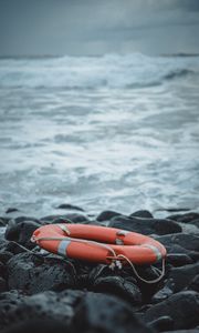 Preview wallpaper lifebuoy, sea, shore, stones, waves