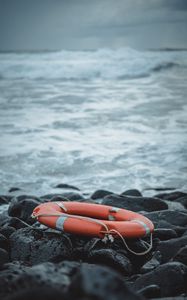 Preview wallpaper lifebuoy, sea, shore, stones, waves