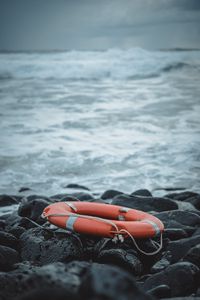 Preview wallpaper lifebuoy, sea, shore, stones, waves