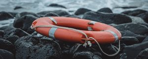 Preview wallpaper lifebuoy, sea, shore, stones, waves