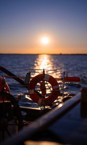 Preview wallpaper lifebuoy, sea, sunset, blur