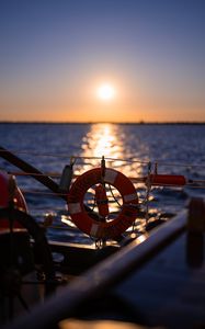 Preview wallpaper lifebuoy, sea, sunset, blur