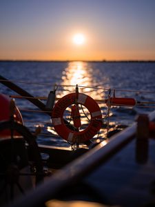 Preview wallpaper lifebuoy, sea, sunset, blur