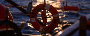 Preview wallpaper lifebuoy, sea, sunset, blur