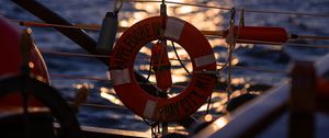 Preview wallpaper lifebuoy, sea, sunset, blur