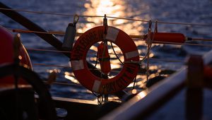 Preview wallpaper lifebuoy, sea, sunset, blur