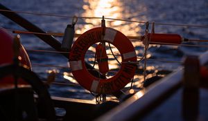 Preview wallpaper lifebuoy, sea, sunset, blur