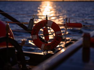 Preview wallpaper lifebuoy, sea, sunset, blur