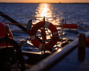 Preview wallpaper lifebuoy, sea, sunset, blur