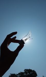 Preview wallpaper light bulb, hand, broken, sky