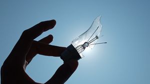 Preview wallpaper light bulb, hand, broken, sky