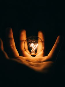 Preview wallpaper light bulb, hand, palm, dark, electricity