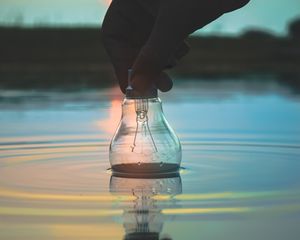 Preview wallpaper light bulb, hand, water, wet, waves