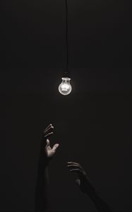Preview wallpaper light bulb, hands, dark, lighting