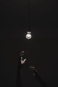 Preview wallpaper light bulb, hands, dark, lighting