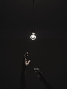 Preview wallpaper light bulb, hands, dark, lighting