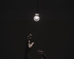 Preview wallpaper light bulb, hands, dark, lighting
