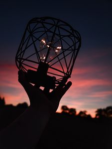 Preview wallpaper light bulb, lantern, hand, dark, dusk