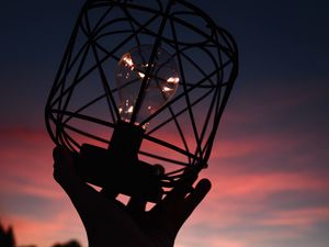 Preview wallpaper light bulb, lantern, hand, dark, dusk