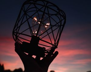 Preview wallpaper light bulb, lantern, hand, dark, dusk