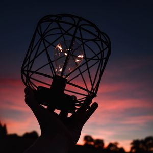 Preview wallpaper light bulb, lantern, hand, dark, dusk