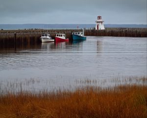 Preview wallpaper lighthouse, boats, sea, pier