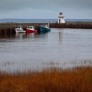 Preview wallpaper lighthouse, boats, sea, pier